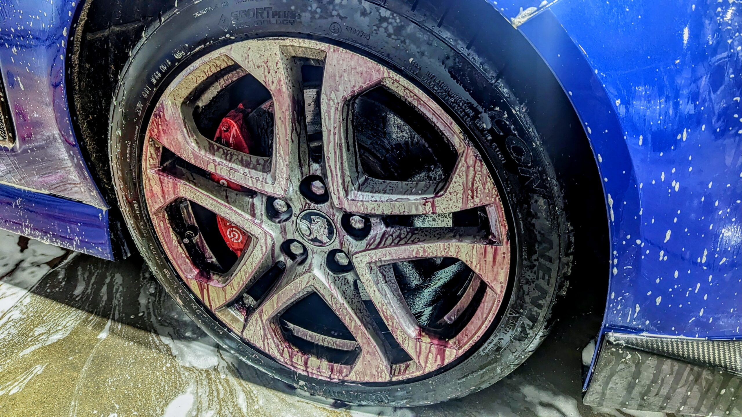 Ceramic Coating on a Rim Being Cleaned with Iron Remover. 